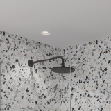 Product lifestyle Image of Britton Hoxton 2.0 Matt Black Shower Head and Arm in Terrazzo style bathroom HOX300M